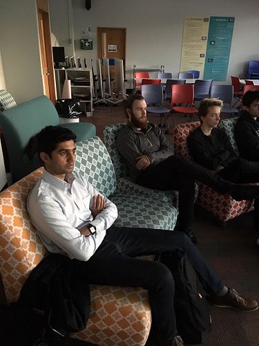 AJ, Kirio and Finn listening to Rebecca's presenta