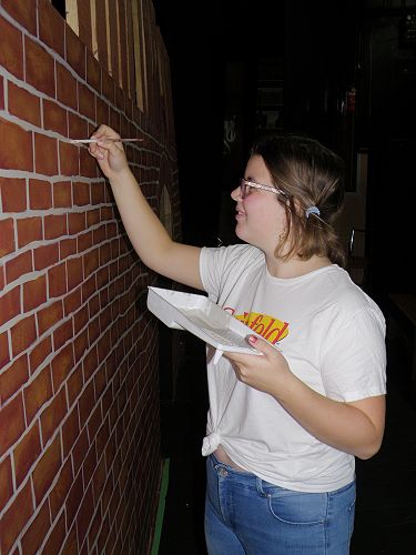Sophie's hard at work making the bricks look Victorian.