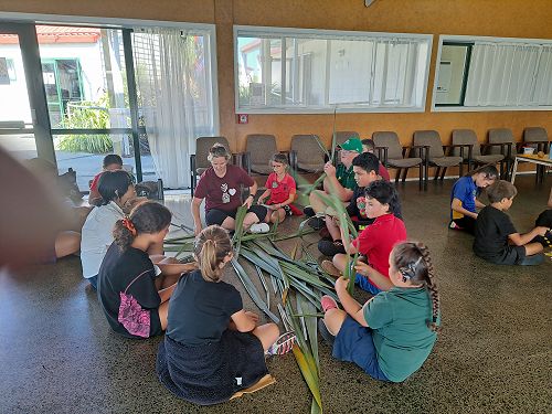 Kit Day Marae learning to weave flax