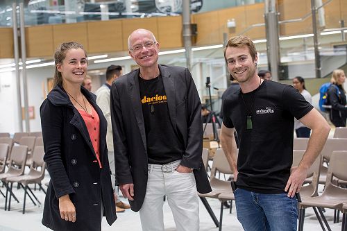 Same three smiling to the camera