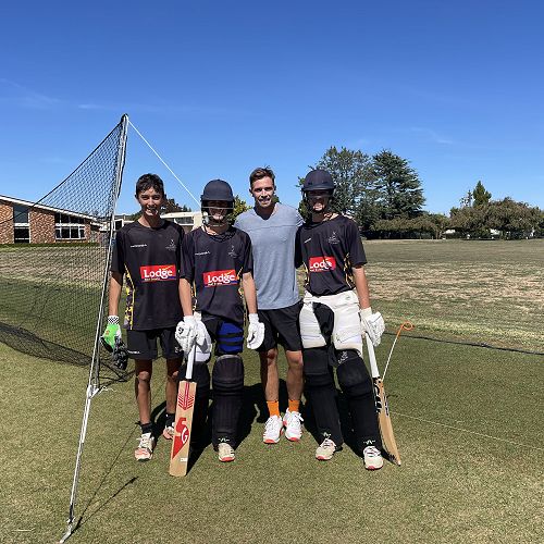 Tim Southee and students play cricket