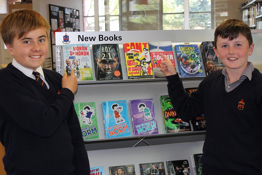 Benedict Kyle and Sam Hope promoting the new books in the library