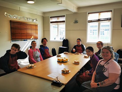 COMCOL group enjoying club sandwiches for afternoon tea
