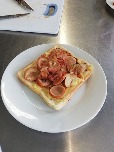 Meat lovers pizza with a bread base. 