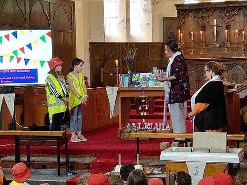 Resources are blessed before giving them to the Port Chalmers School Library Monitors (Rev'd Shirley Brunton and Rev'd Rose Scott in Holy Trinity Church)