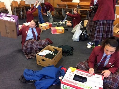 Year 11 Societies & Citizenship students organise donated clothing to send to Vinnies as part of their class social action on poverty in the local community