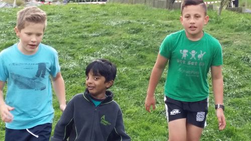 Vishakan running his first Cross Country at Amesbury School with senior students, Chris and Khan