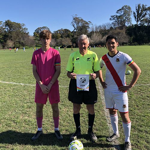 The HBHS 1st XI Captain Latham Magele with the Macleans College goalkeeper in the inaugural Pride round at the tournament.