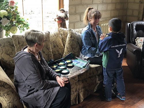 Mrs Hogg and Hannah Scott presenting personalised rosettes