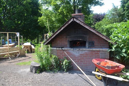 Wood-fired oven with community vegetable garden behind, Dufferin Grove Park, Toronto