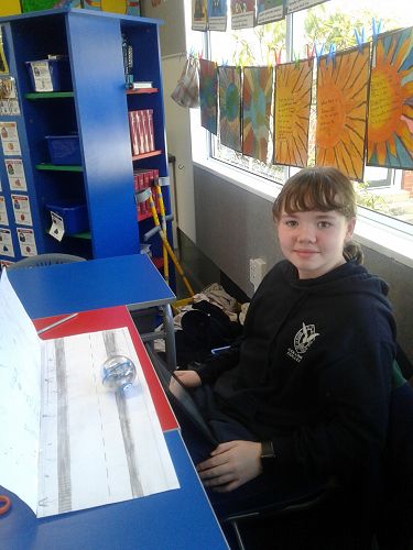 Rylee Duthie ensuring her Sphero is able to travel along her footpath and squeeze into the small opening.