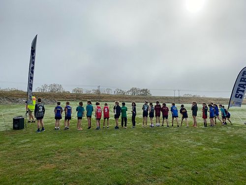 Year 5 mixed and girls about to begin the running leg of the course