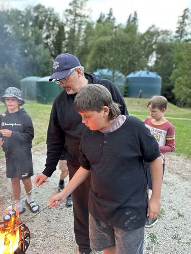 Father and son enjoying the fire!