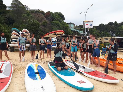 Learning the basics of paddle-boarding.