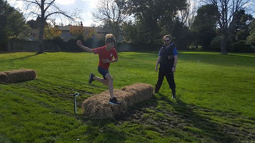 Terenzo leaping the hay bales