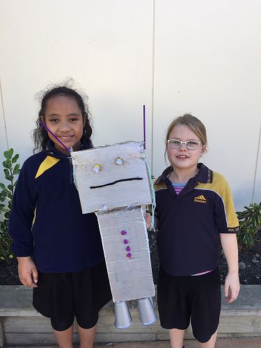 Neriah and Paige with their robot, Steely.