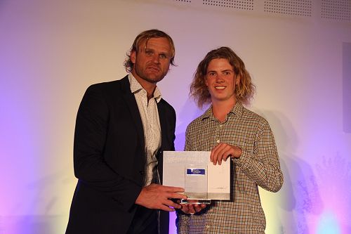 Scott Roberston presents Dan Stewart with his Lincoln University Blue for Water Skiing