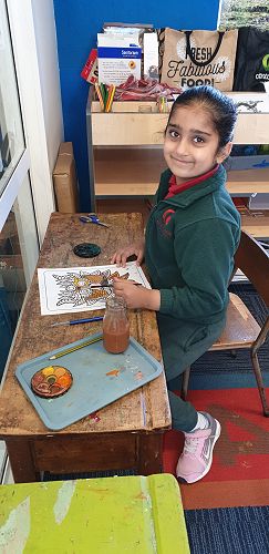 Using watercolours to paint a dragon