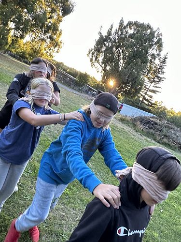 Harvey, Alex, Evie and Tanesha getting ready for the nightline- following a rope through the forest.