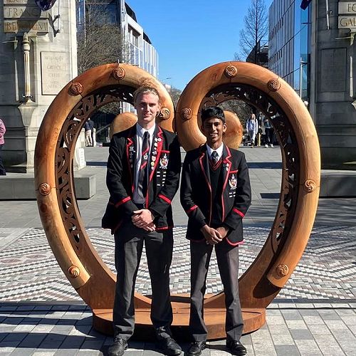 Year 13 students Ryan Wilson, left, and Stefan Marasinghe Arachchige Don in front of the Fayne Robinson sculpture.