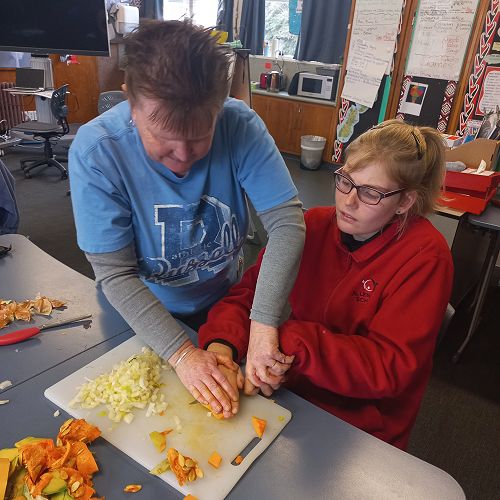 Talia also had a go at cutting soft pumpkin with the help of her friend.