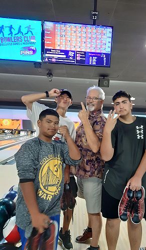 Ten pin bowling (from left to right) Callan, Harry, Douglas, and Holden