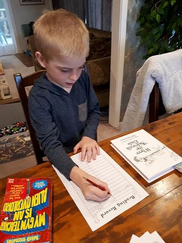 Leo Mundy (Year 3) working on his Reading log.