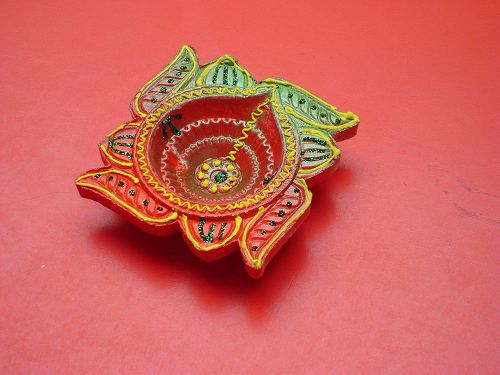 A decorated diva (lamp) holder