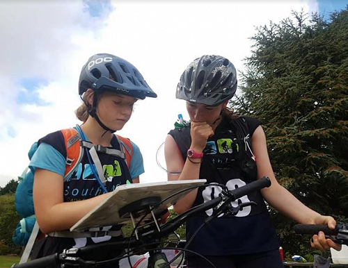 Caitlin O’Brien and Saskia Learmonth deciding on where to go to next (South IslandSecondary Schools Adventure Race 2019)