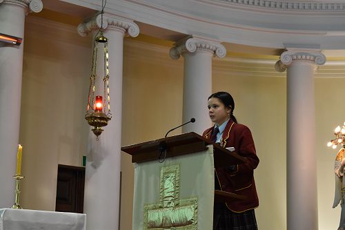 Ainemaria reading at the College Mass