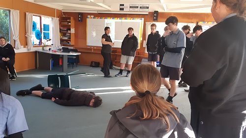 Assessing another accident scenario, before commencing First Aid.