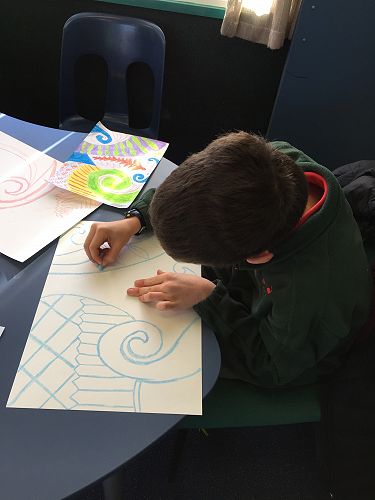 Carefully does it - Taylor focussing hard on creating bold chalk lines.