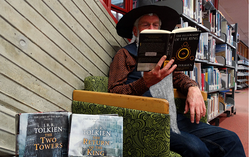 Dr Paul Tankard, disguised as Gandalf, reading from The Lord of the Rings for Reading Allowed.  Photo credit: Ali Boyne