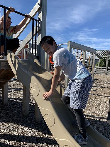Timothy also likes to climb up slides! 