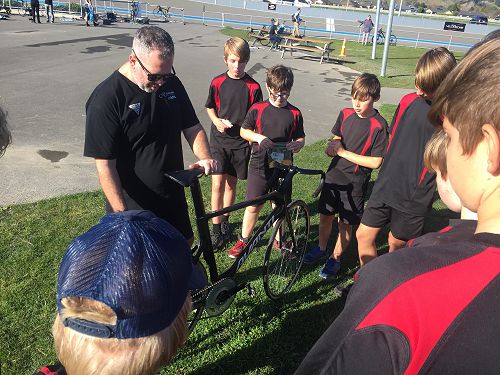 Students looking over a training bike