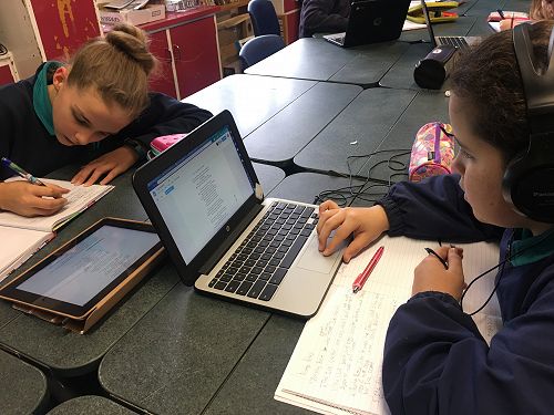 Studying song lyrics with Miss Barr.