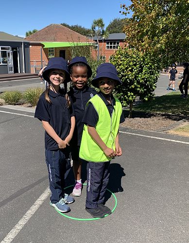 PALs leader Srishti Singh plays the hoop game with Gabriella van Aart and Alicia Chiruka