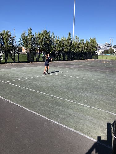 Nora Paicu goes for a slam mid court