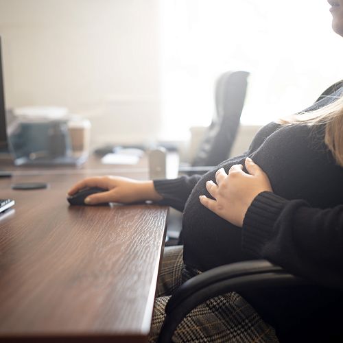 Pregnant at computer