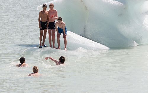 En Watanabe, Angus Frew and Marcus Beagley watch on as their peers swim over. Just a little chilly.