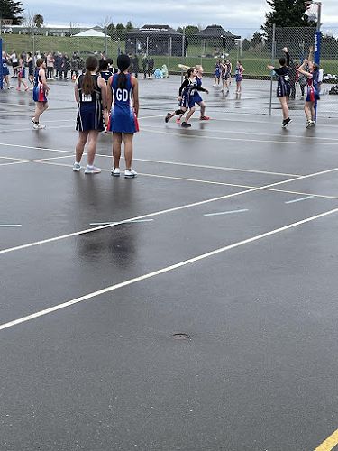 9B team against St. Kevin’s Poppy Radford (GA) watches Charlotte Mohuanga and Baylee Walker in the defensive circle 