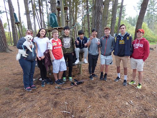 The boys, host siblings teacher and dog at Adrenaline Forest high ropes course out at Spencerville