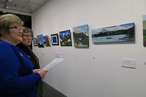 Artist Susan Cook and Yvonne Johnstone admiring so
