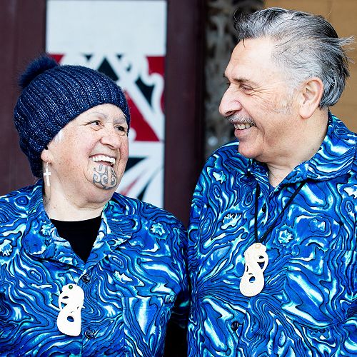 Whaea Diana Peita and Matua Waata in front of the Marae