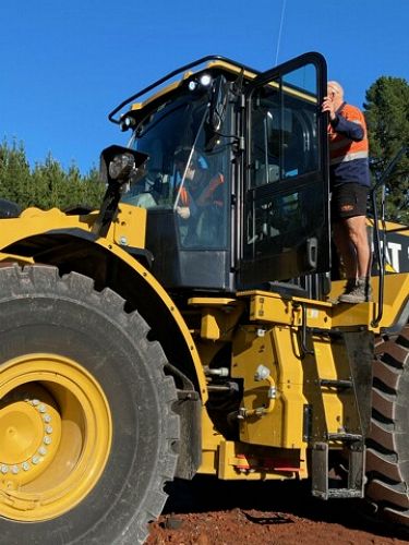 Scott being shown the in and outs of earth moving machines