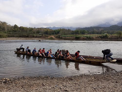 The World Challenge crew boating in Laos.