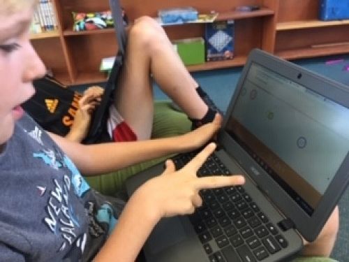 Jamie is keen to beat the computer in a brain science maths game.