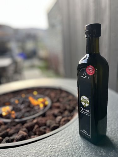 The Red Sticker means Certified as EVOO by Olives NZ.