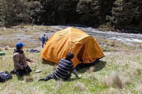 Jin and Alex (10MB) take a break while setting up their accommodation for the night.