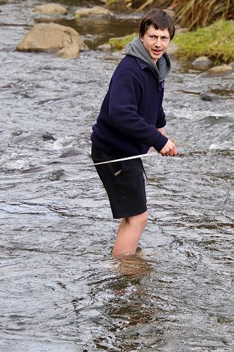 George Connor braves the not overly warm waters of Leith as only a Stewart Island man can, barefoot.